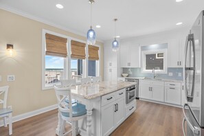 Fridge, microwave, oven, stovetop - Ocean Club of Kure Beach - Oceanfront, pet friendly home with Private pool & Hot (Kure Beach)
