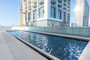 Pool - Free housekeeping visits during your stay - StayShort - 1BR in JVC that Sleeps 4 with a Balcony! (JVC)