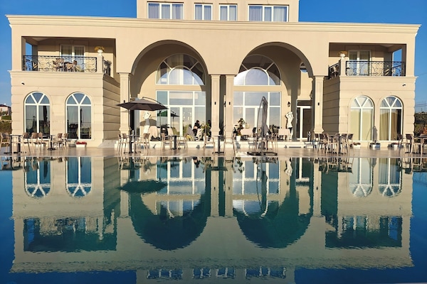 Outdoor pool, pool umbrellas, sun loungers