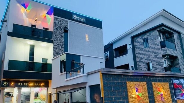 A modern building with a restaurant named "P1 Restaurant" on the ground floor. - P1 Place Hotel (Lagos)