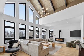 Superior Condo, Mountain View | Living area | 60-inch Smart TV with digital channels, fireplace - 203 Verbier Building 11 (Mont-Tremblant)