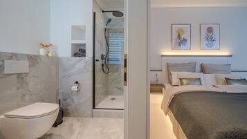 Shower, towels, soap, toilet paper