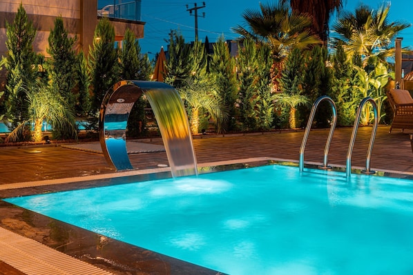 4 outdoor pools, open 8:30 AM to 10:30 PM, pool umbrellas, sun loungers