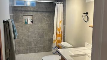 Shower, towels, soap, toilet paper