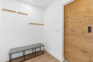 Convenient coat and hanger space designed with a hotel-level touch