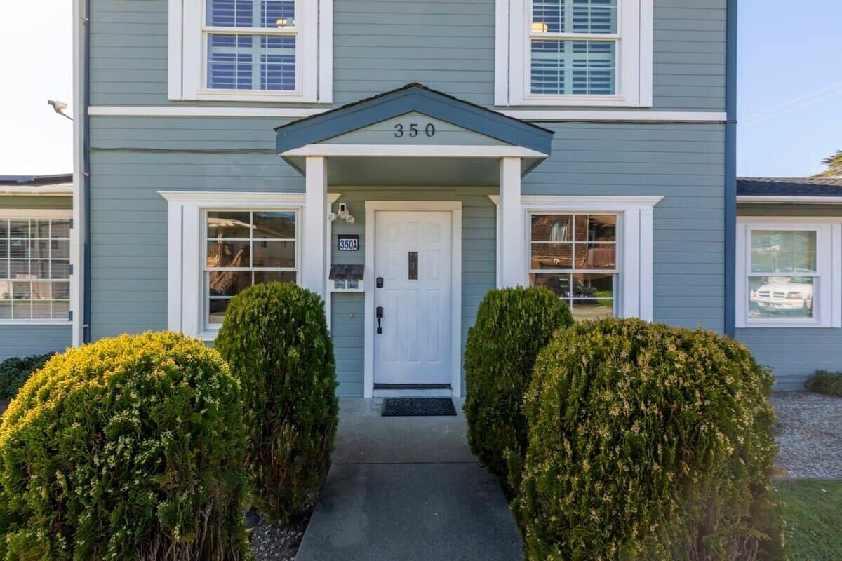A two-story building with a white door and the number 350 above it.