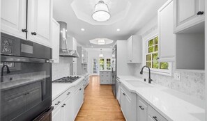 Fridge, microwave, stovetop, dining tables
