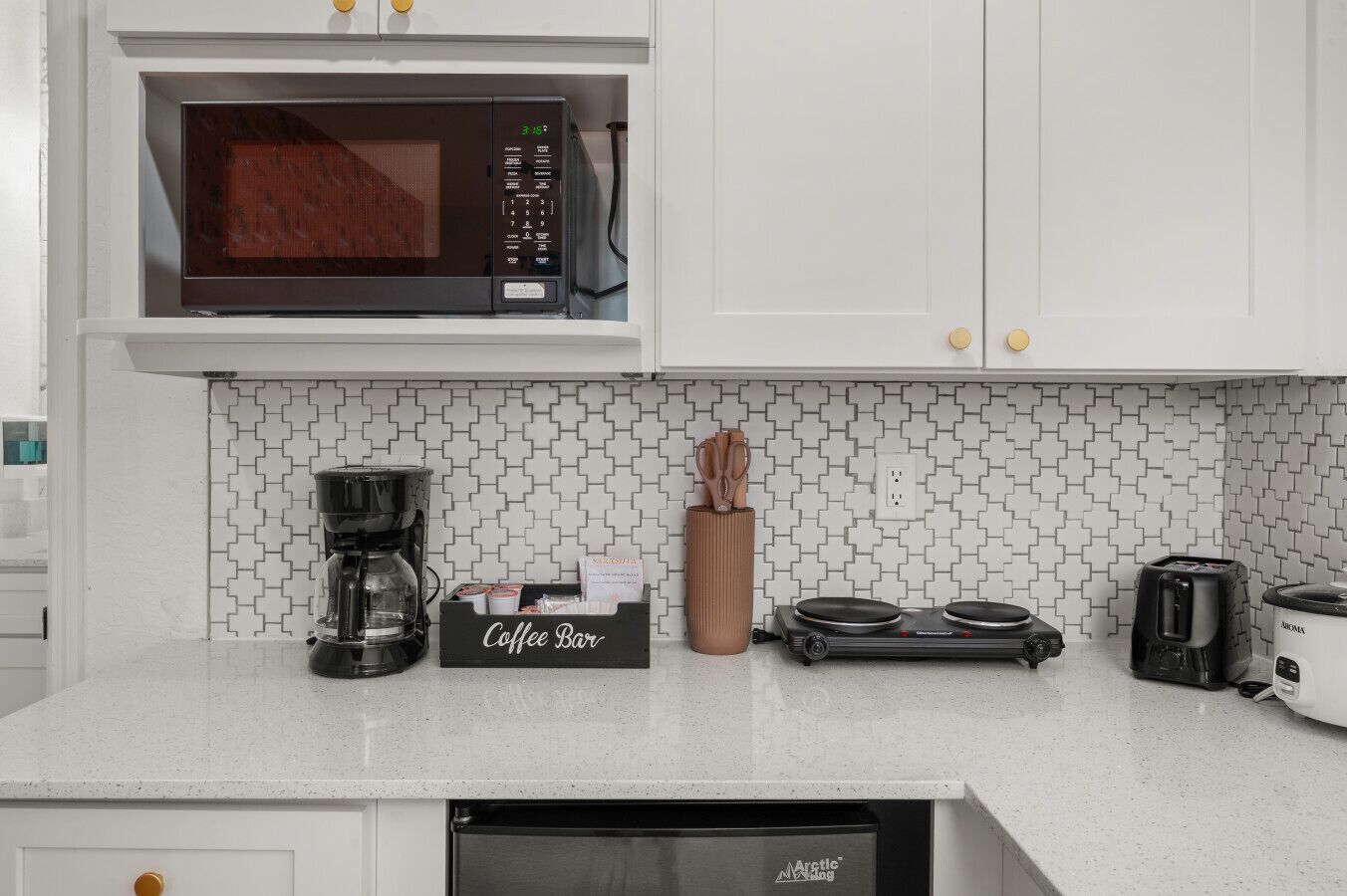 Microwave, stovetop, coffee/tea maker, toaster