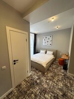 Deluxe Double Room, Courtyard View | Blackout drapes, soundproofing, iron/ironing board, free WiFi