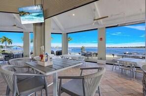 Outdoor dining - Single family home with stunning views of golf course and private saltwater pool (Naples)
