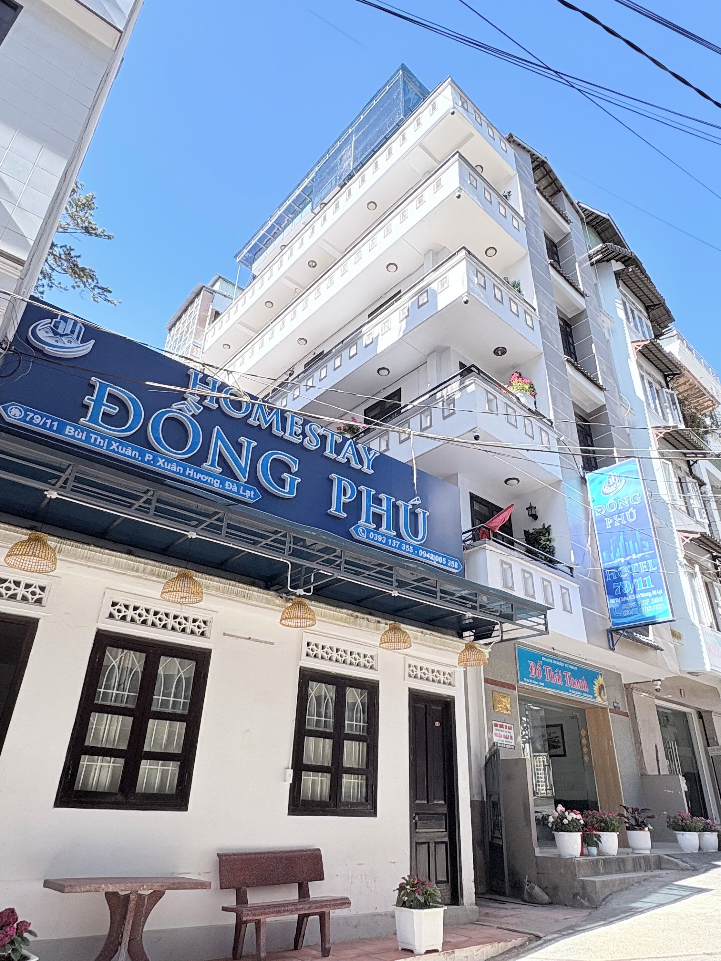 A building with a sign for Dong Phu hotel.