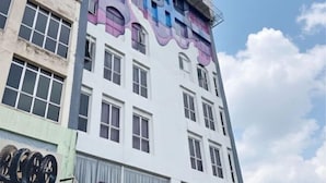 A multi-story building with a sign indicating it is a hotel. - Swing & Pillows @ Kajang Selangor (Kajang)
