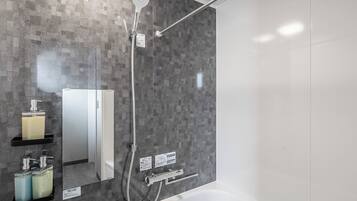 Combined shower/tub, free toiletries, hair dryer, slippers