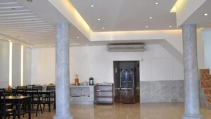 A spacious lobby with a high ceiling, marble flooring, and a reception desk. - VangVieng Boutique Hotel (Vang Vieng)