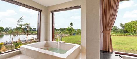 Separate bathtub and shower, hair dryer, slippers, towels