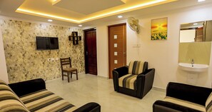 Living area - Affordable garden‑view stay in misty Munnar (Chithirapuram)