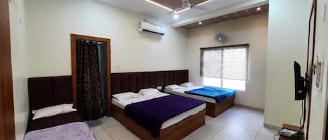 Family Room | Premium bedding, desk, laptop workspace, soundproofing