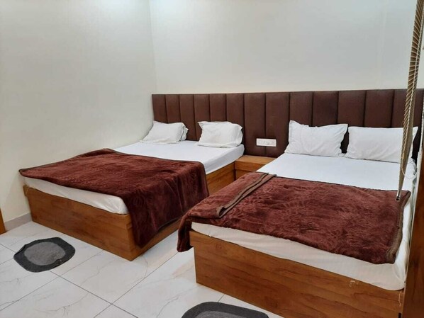 Deluxe Quadruple Room | Premium bedding, desk, laptop workspace, soundproofing - Hotel G R Inn near Temple & Rail Station (Ujjain)