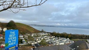 A residential area with a sign advertising 'THE BEST VIEWS IN THE AREA' at Waterside Holiday Park. - Waterside, Paignton - Holiday Accommodation 19143 (Paignton)