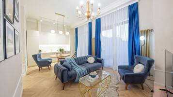 Apartment, City View | Living room | Flat-screen TV