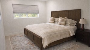 Un dormitorio con cama de madera, una mesita de noche, una lámpara, una ventana con persianas y una alfombra estampada.