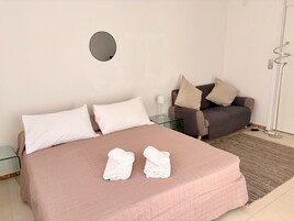 Comfort Apartment, Partial Sea View | Desk, laptop workspace, iron/ironing board, free WiFi