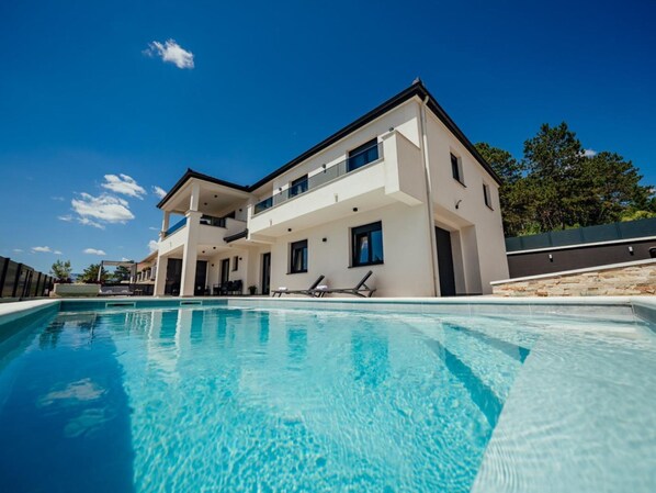 A modern two-story house with a swimming pool in front. - Villa Budimir by Interhome (Imotski)
