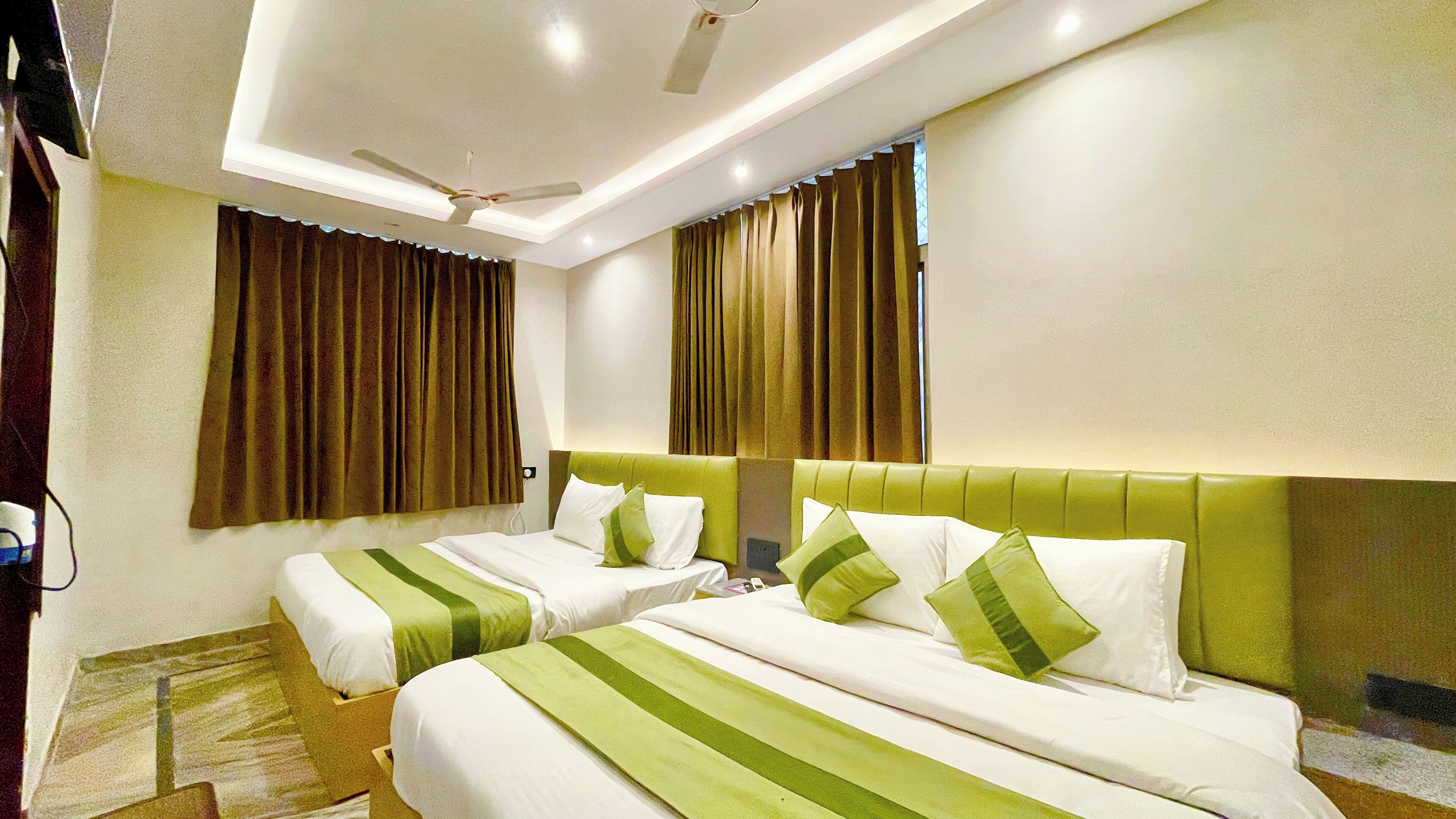 Deluxe Quadruple Room | Premium bedding, desk, laptop workspace, soundproofing