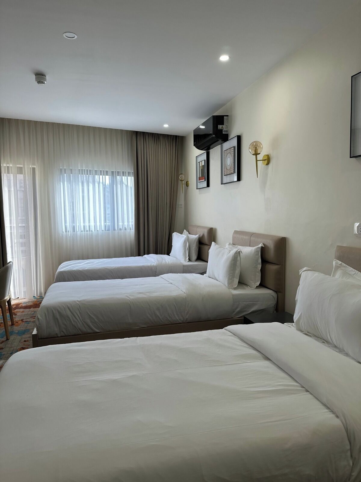 Triple Room, Balcony, City View | In-room safe, desk, laptop workspace, blackout drapes