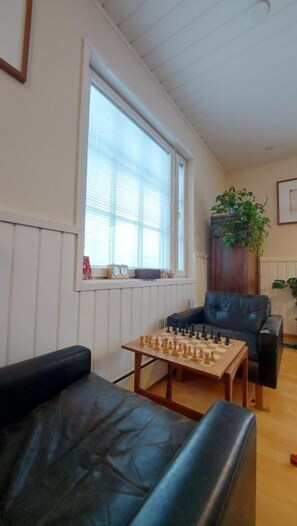 Interior - Traditional Lapland Cottage with fireplace & glass room for aurora hunting (Rovaniemi)