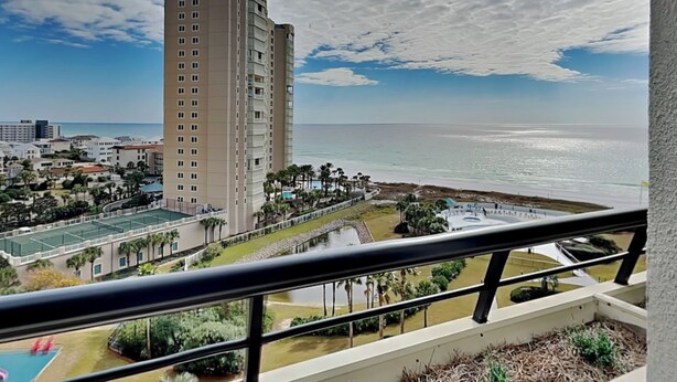 A high-rise hotel with a view of the ocean and a pool area. - Edgewater #1101 | Gulf Front + Resort Amenities (Miramar Beach)