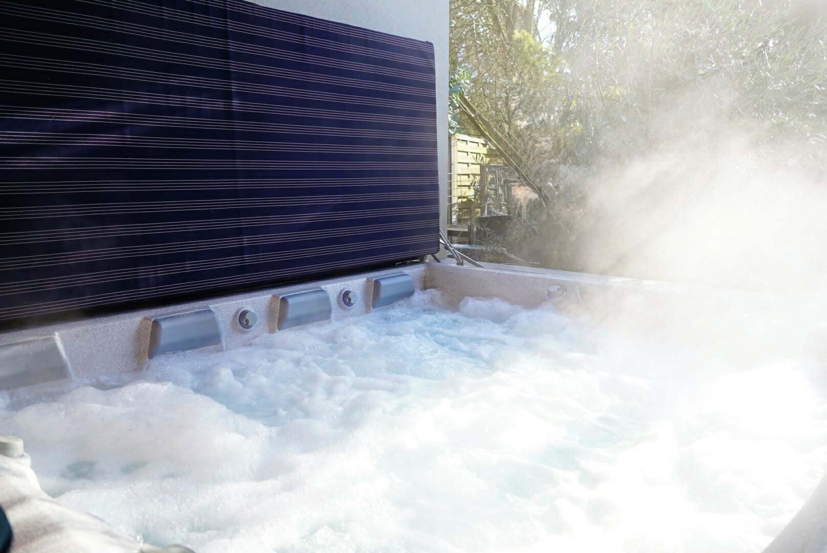 A hot tub with visible jets and a dark panel on the side.
