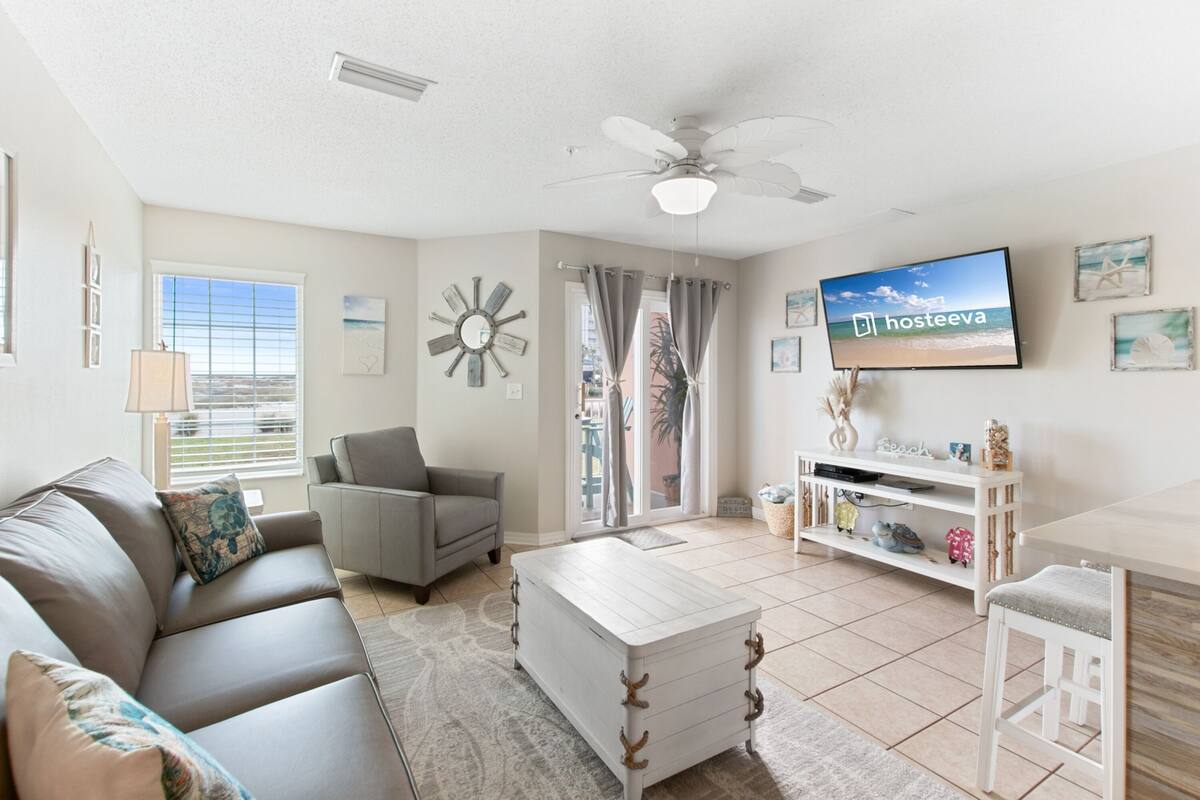 Family Condo, Balcony | Living room | 55-inch Smart TV with cable channels