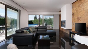 A modern living room with a sectional sofa, a coffee table, and a flat-screen TV. - Villa Marina Casa Luxuosa c/Piscina by LovelyStay (Ferragudo)