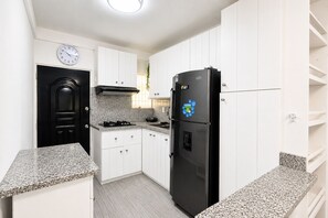 Private kitchen - Nice 2-bedroom apartment with AC in Playa Juan Dolio (Playa Juan Dolio)