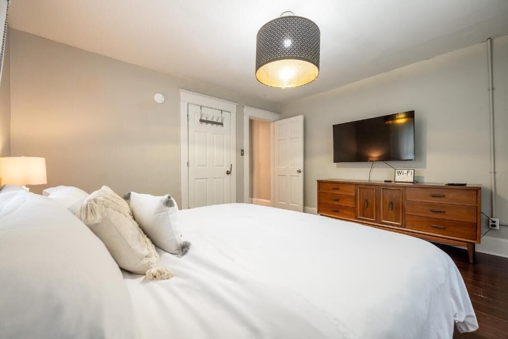 Premium bedding, blackout curtains, iron/ironing board, free WiFi