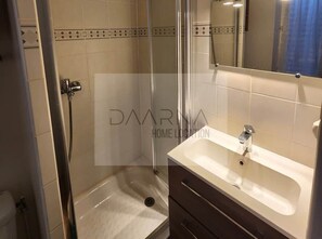 Shower, hair dryer, soap, toilet paper