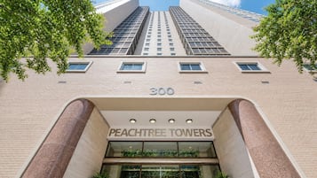 A building with a prominent entrance labeled '300 PEACHTREE TOWERS' and a large number '300' on the facade.