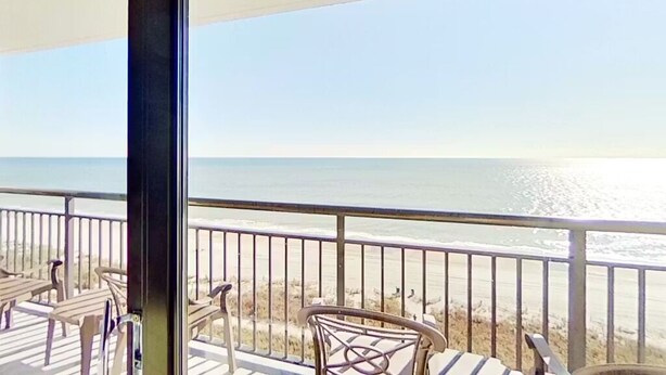A balcony with a view of the beach and ocean. - Rare find! Ocean front bedroom, Pet friendly! (Myrtle Beach)