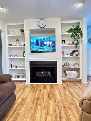 Smart TV, fireplace, table football, books