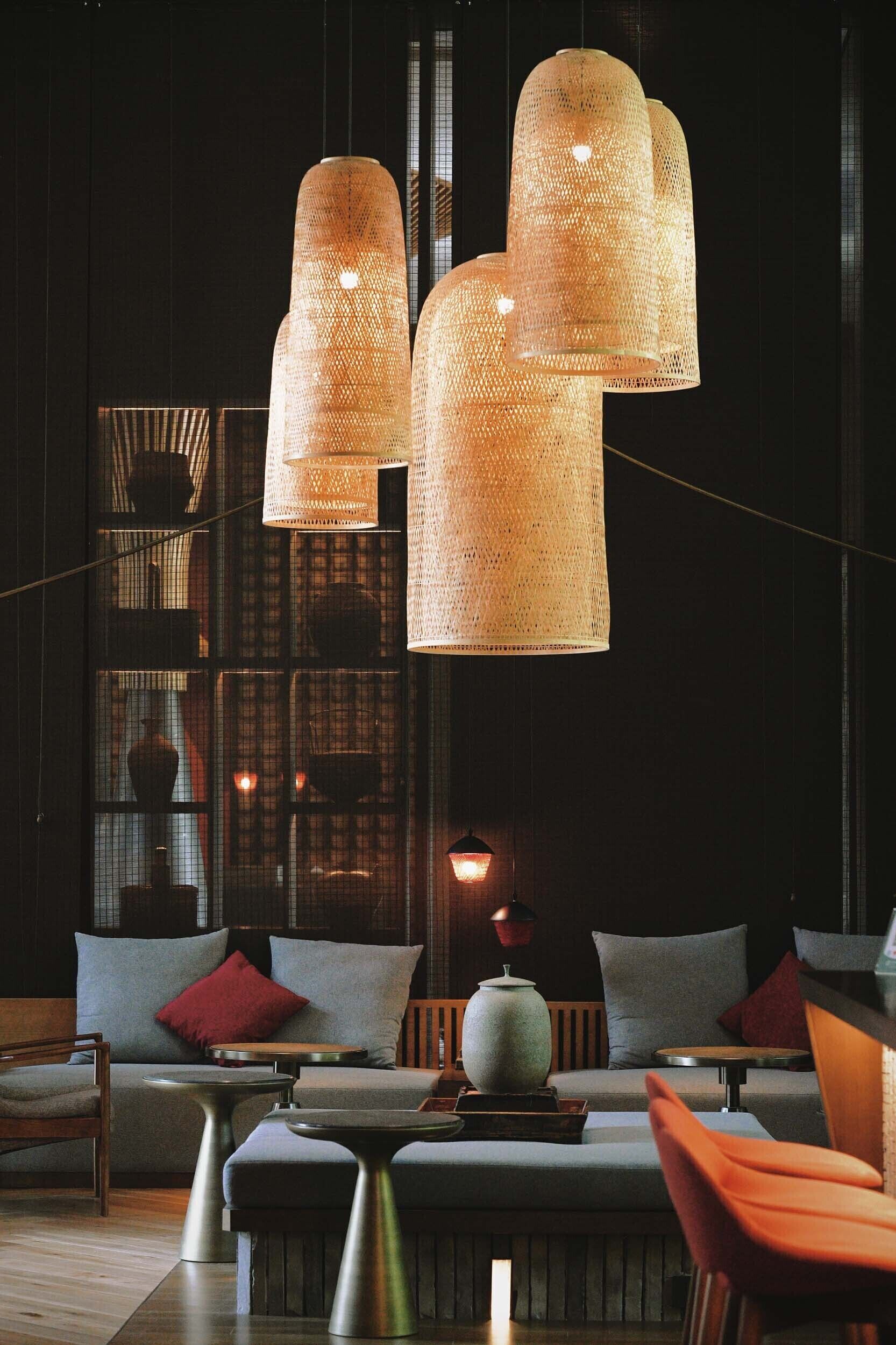 A modern interior with a sofa, chairs, and a table.