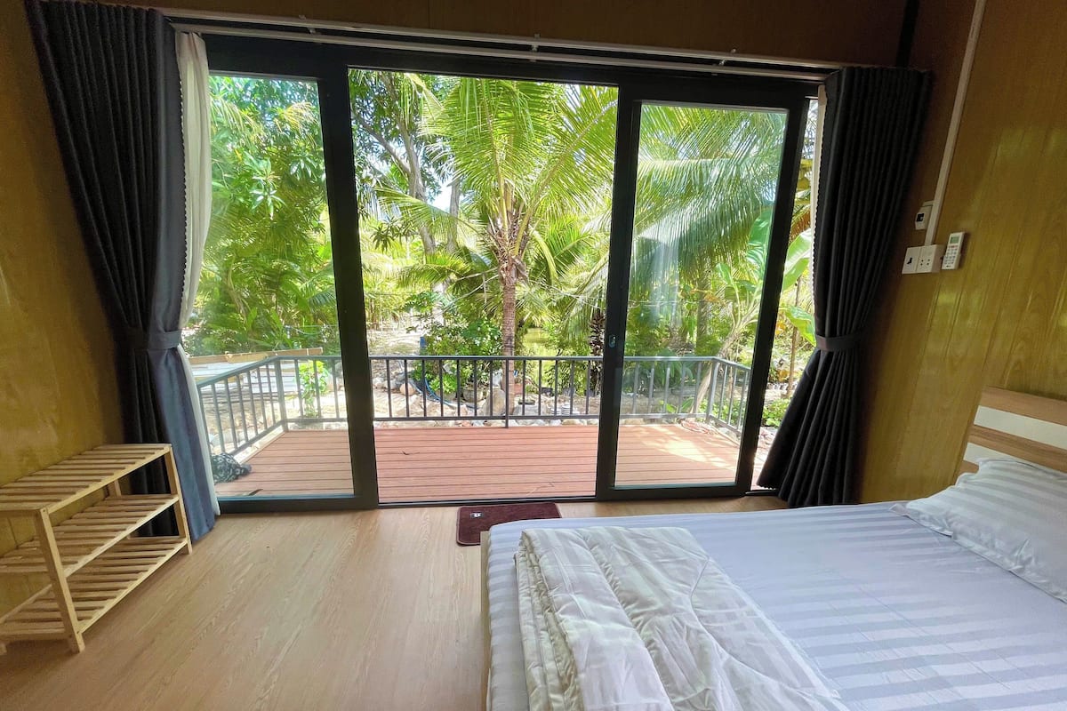 Family Room, Balcony, Garden View | Garden view