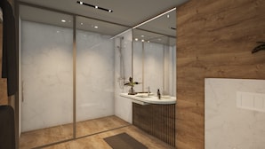A modern bathroom with a glass shower enclosure, a wooden vanity with a sink, and a mirror. - Domaine Le H (Hohrod)