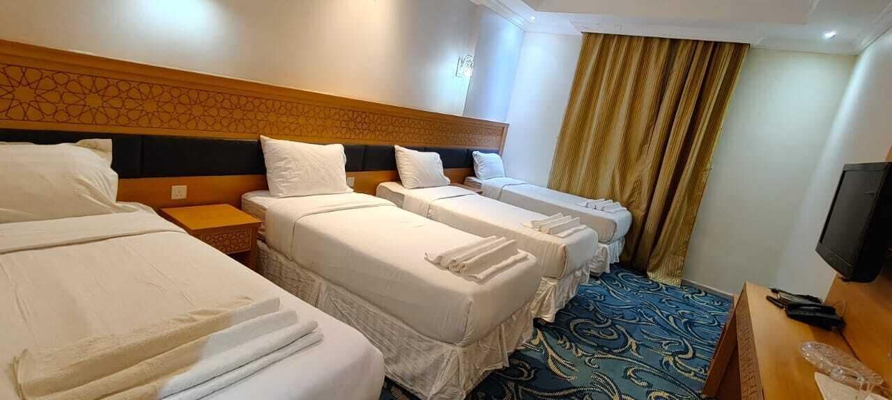 Deluxe Quadruple Room | Laptop workspace