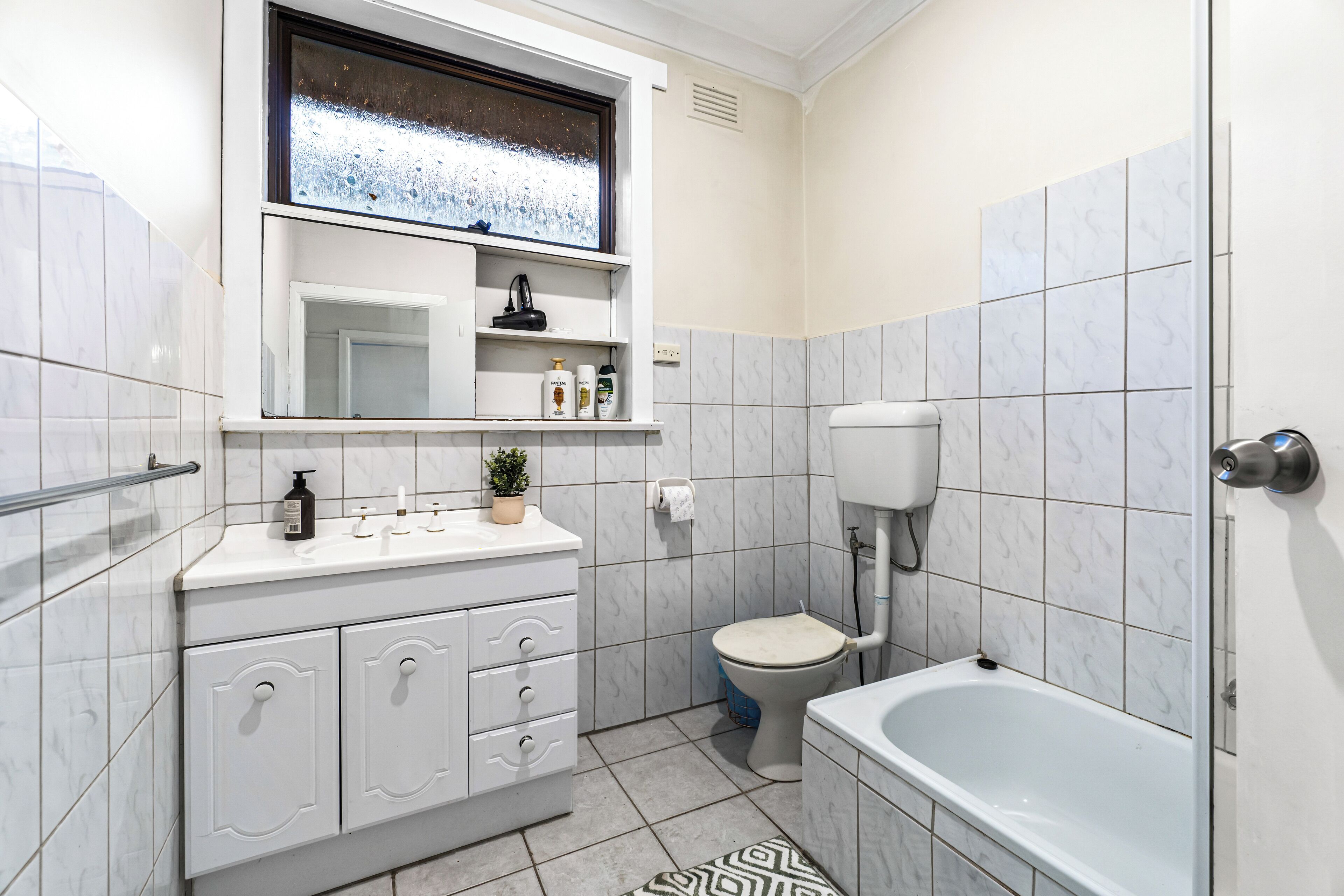 Eco-friendly toiletries, hair dryer, towels, toilet paper