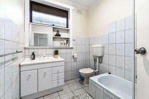 Eco-friendly toiletries, hair dryer, towels, toilet paper