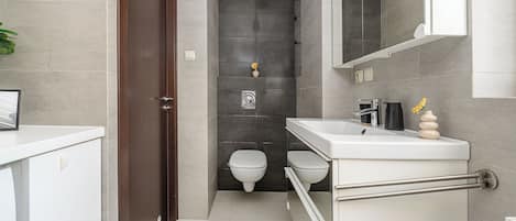 Departamento Confort, balcón | Baño