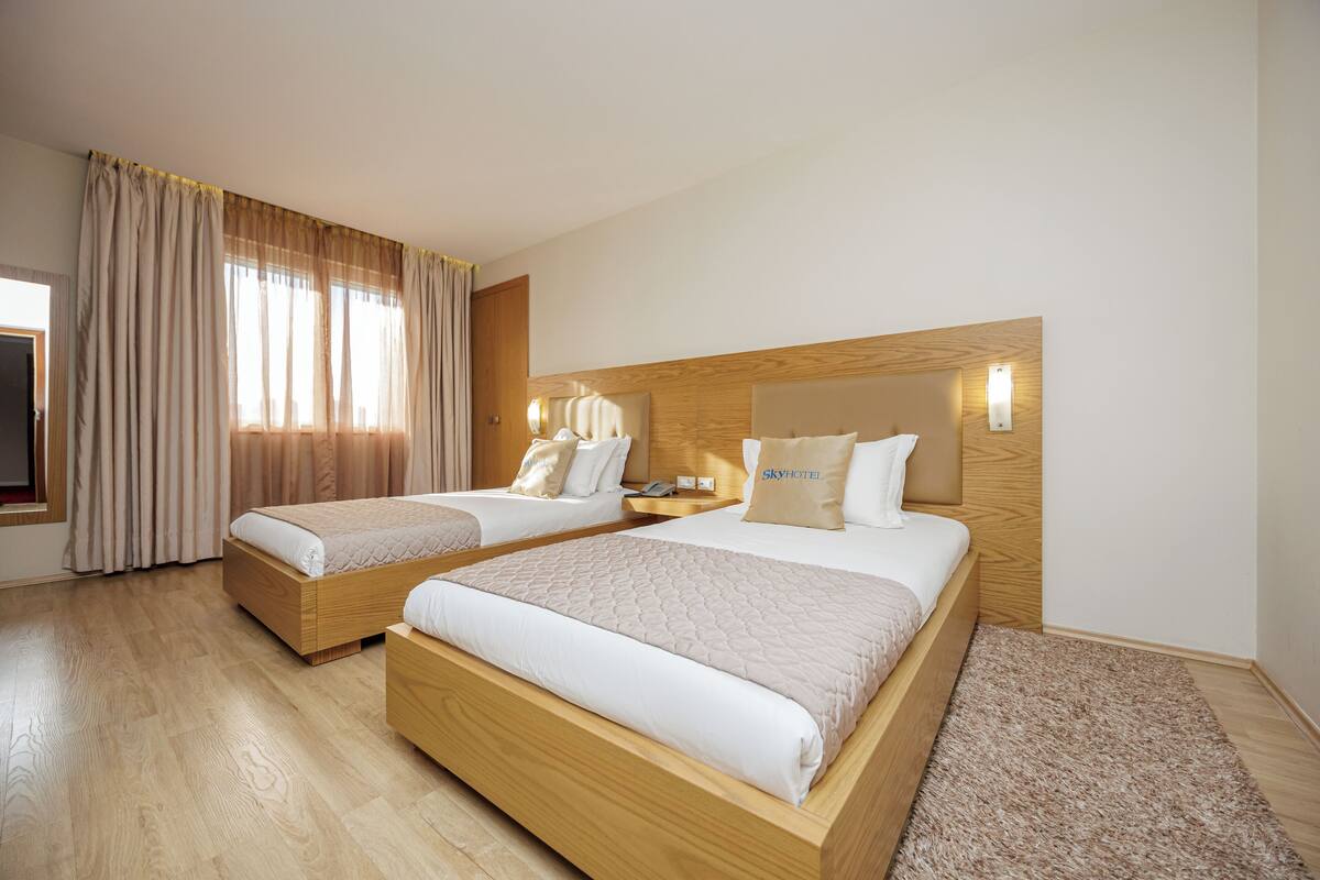 Standard Twin Room, City View | In-room safe, desk, iron/ironing board, free WiFi