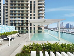 Outdoor pool - 2BR Beachfront Retreat with Palm Views (Dubai)