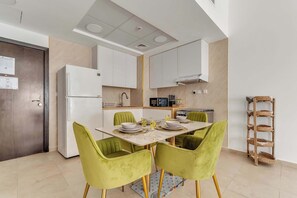 Fridge, microwave, oven, stovetop - Free housekeeping visits during your stay - StayShort - 1 Bed in Dubai Land that Sleeps 2 with Balcony! (Dubai Land)